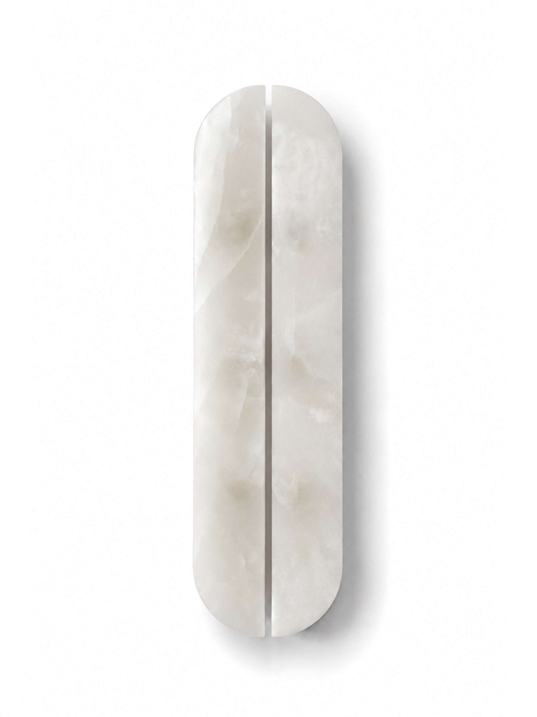 A vertically oriented, elongated oval cabinet or drawer handle made of polished white marble with a central seam, shown on a clean white background.